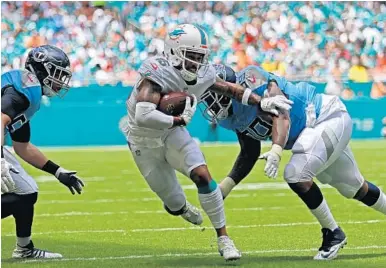  ?? JOHN MCCALL / SUN SENTINEL ?? Dolphins wide receiver Albert Wilson takes pride in getting defenders to miss him and being a catalyst for offensive drives, and exciting his teammates with an explosive play.