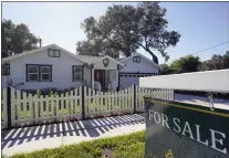  ?? JOHN RAOUX — THE ASSOCIATED PRESS FILE ?? A home for sale in Orlando, Fla. The National Associatio­n of Realtors said Tuesday that existing home sales fell 3.4% last month from April to a seasonally adjusted annual rate of 5.41 million.