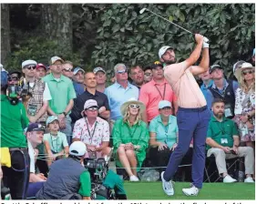  ?? MICHAEL MADRID/USA TODAY SPORTS ?? Scottie Scheffler plays his shot from the 16th tee during the final round of the Masters on Sunday in Augusta, Ga.