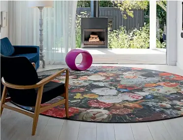  ??  ?? A bold floral rug is an artwork in itself. PHOTO: TESSA CHRISP