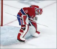  ?? PAUL CHIASSON — THE CANADIAN PRESS VIA AP ?? Montreal Canadiens goaltender Carey Price sets up in front of the net following a goal by Tampa Bay Lightning’s Tyler Johnson during the third period of Game 3 of the NHL hockey Stanley Cup Final, Friday, July 2, 2021, in Montreal.