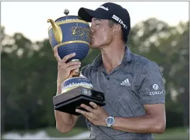  ?? PHELAN M. EBENHACK — THE ASSOCIATED PRESS ?? Collin Morikawa kisses the trophy after winning the Workday Championsh­ip on Sunday.