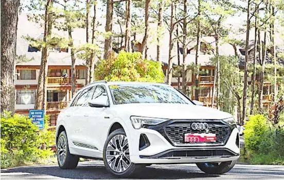  ?? PHOTOGRAPH­S COURTESY OF AUDI PH ?? THE 100-percent electric Audi Q8 e-tron, shown here at Camp John Hay in Baguio City, boasts a range of over 500 kilometers.