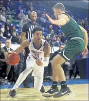  ?? JULIA MALAKIE / SENTINEL & ENTERPRISE FILE ?? UMass Lowell’s Obadiah Noel drives against Binghamton’s Dan Petcash during a game last season.