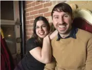  ?? J.P. MOCZULSKI FOR THE TORONTO STAR ?? Profession­al “rent-a-friend” Cassandra Lemon and Star reporter Ryan Porter enjoy an evening at the Painted Lady bar.