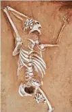  ?? Courtesy Qian Wang ?? Texas A&M professor Qian Wang proved that the skeleton found in an ancient Chinese tomb was a murder victim, not a grave robber.