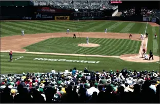  ?? DOUG DURAN STAFF ARCHIVES ?? The RingCentra­l logo can be seen on the field as fans watch the Oakland A's play the Los Angeles Angels at the Oakland Coliseum on July 20, 2021. The software company said it would be pulling its naming rights for the Coliseum.