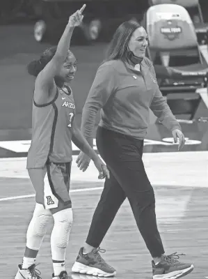  ?? TROY TAORMINA/USA TODAY SPORTS ?? Arizona guard Aari Mcdonald (2) and coach Adia Barnes, right, stunned Uconn to reach the national title game.