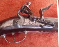  ??  ?? Above: Lockplate with Harvey signature Right: Pair of pistols by Harvey