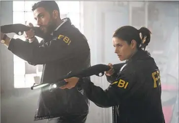  ?? Michael Parmelee CBS ?? AGENTS Omar Adom “OA” Zidan (Zeeko Zaki) and Maggie Bell (Missy Peregrym) in a new kind of “FBI.”