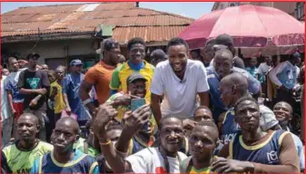  ?? ?? John Obi Mikel in photo session with Lagos Island team after the match