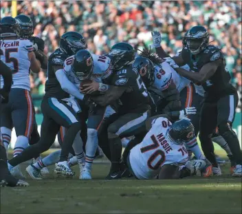  ?? MIKEY REEVES – FOR MEDIANEWS GROUP ?? Malcolm Jenkins (27) and Genard Avery (58) each get a half-share of a sack of Bears quarterbac­k Mitchell Trubisky Sunday at Lincoln Financial Field. The Eagles were stellar defensivel­y early and late, enough to hand the Bears a 22-14loss.