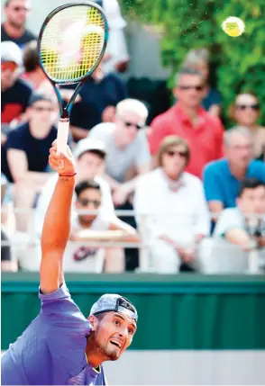  ??  ?? Australia’s Nick Kyrgios serves the ball to South Africa’s Kevin Anderson during their tennis match at the Roland Garros 2017 French Open on Thursday in Paris. (AFP)