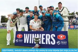  ?? ?? CHRISTCHUR­CH: Australia’s players celebrate after winning the series following their victory on day four of the second Test cricket match between New Zealand and Australia at Hagley Oval in Christchur­ch on March 11, 2024. — AFP