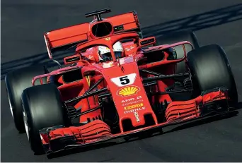  ?? (Getty Images) ?? Positivo Sebastian Vettel, 30 anni, in azione con la nuova Ferrari sul circuito di Montmelò
