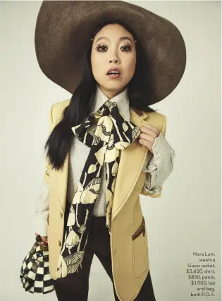  ??  ?? Nora Lum, wears a Gucci jacket, $3,450, shirt, $850, pants, $1,900, hat and bag, both P.O.A.