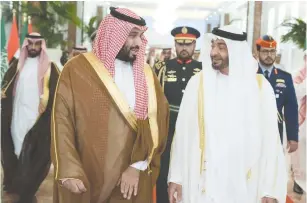  ?? (WAM/Reuters) ?? ABU DHABI’S Crown Prince Sheikh Mohammed bin Zayed al-Nahyan (right) receives Saudi Crown Prince Mohammed bin Salman at the Presidenti­al Airport in Abu Dhabi.