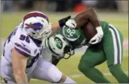  ?? BILL KOSTROUN - THE ASSOCIATED PRESS ?? FILE - In this Nov. 2, 2017, file photo, Buffalo Bills defensive tackle Kyle Williams (95) brings down New York Jets running back Bilal Powell (29) during the first half of an NFL football game in East Rutherford, N.J.