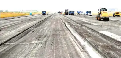  ??  ?? Repair work progresses on the runway of Nnamdi Azikiwe Internatio­nal Airport in Abuja yesterday