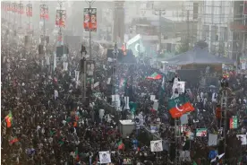  ?? Photograph: Akhtar Soomro/Reuters ?? Supporters of Pakistan's former prime minister Imran Khan gather in Rawalpindi to see his first public appearance since being wounded in a gun attack earlier this month.