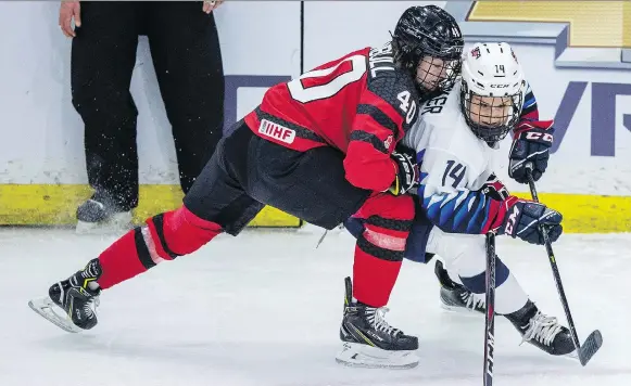  ?? LIAM RICHARDS/THE CANADIAN PRESS ?? Canada’s Blayre Turnbull and U.S. forward Brianna Decker battle it out during Wednesday’s 4 Nations Cup game at Sasktel Centre, won by the U.S. 2-1.