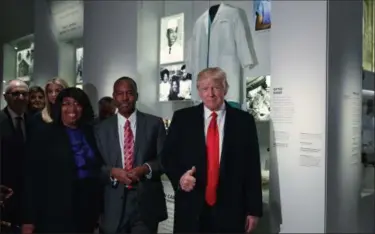  ?? EVAN VUCCI — THE ASSOCIATED PRESS FILE ?? President Donald Trump gives a thumbs up during a tour of the National Museum of African American History and Culture with Housing and Urban Developmen­t Secretary-designate Dr. Ben Carson and his wife Candy Carson in Washington.