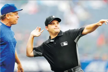  ?? NOAH K. MURRAY/THE ASSOCIATED PRESS ?? First base umpire Jansen Visconti tosses Blue Jays manager John Gibbons out of the game during the sixth inning of Toronto’s 10-2 loss to the Yankees on Sunday in New York. The Jays were swept as they surrendere­d 28 runs in the three-game series.