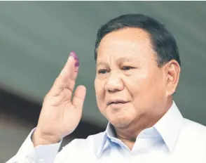  ?? — AFP photo ?? Fitch Ratings head of Asia-Pacific sovereigns Thomas Rookmaaker said Prabowo’s projected victory should reduce near-term political uncertaint­y, although the announceme­nt of official results might take another month.