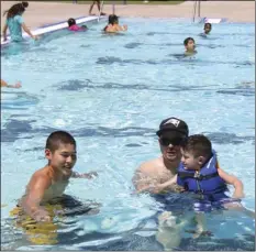  ?? PHOTO ?? From Left: Jordan Espinoza, Manuel Cardenas and Julian Espinoza at the Slash Party free swim at the Lion Center, Brawley, Saturday. WILLIAM ROLLER