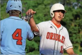  ?? THOMAS NASH - DIGITAL FIRST MEDIA ?? Daniel Boone’s Victor Gonzalez, right, celebrates with Chase Lacey after scoring a run during the bottom of the sixth inning of Saturday’s game against Exeter. Below, Daniel Boone’s Tim Richard delivers to the plate.