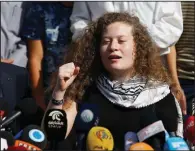  ?? AP/MAJDI MOHAMMED ?? Palestinia­n activist Ahed Tamimi speaks Sunday on the outskirts of the West Bank village of Nabi Saleh near the West Bank city of Ramallah.