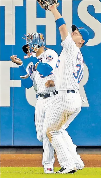  ?? Getty Images ?? DEFENSE IS KEY: Center fielder Michael Conforto — making a catch in front of Yoenis Cespedes in the fifth inning — made a key diving catch in the seventh inning of the Mets’ 3-1 win over the Nationals on Saturday night at Citi Field.
