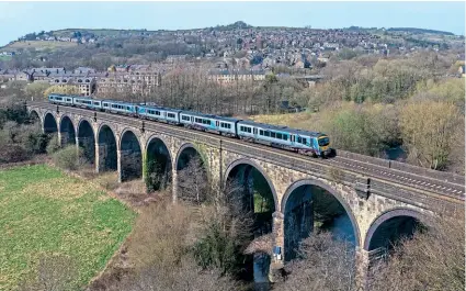  ??  ?? Two unidentifi­ed TransPenni­ne Class 185s cross New Mills Viaduct on March 31 with the 14.18 Manchester Piccadilly-Cleethorpe­s train.