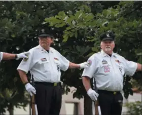 ?? MARIAN DENNIS — DIGITAL FIRST MEDIA ?? The Montgomery County Honor Guard stood above the Vietnam Memorial outside the Montgomery County courthouse, taking part in the POW/MIA Day ceremony.