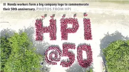  ?? PHOTOS FROM HPI ?? Honda workers form a big company logo to commemorat­e their 50th anniversar­y.