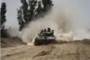  ?? (AP) ?? An Israeli tank moves near the Gaza Strip border in southern Israel, Thursday, April 11, 2024.