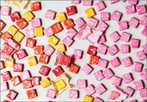  ?? Photos by Jennifer Chase for The Washington Post ?? Our quirky preference­s are driving the future of snacking and the most prominent manifestat­ion of the trend is the pink Starburst, included above. Below, Cap’n Crunch’s Crunch Berries and Cap’n Crunch’s Oops! All Berries.