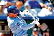  ?? COLIN E. BRALEY/THE ASSOCIATED PRESS ?? Kansas City Royals’ Bobby Witt Jr. hits a three-run homer during the seventh inning of Thursday’s game against the Houston Astros in Kansas City, Mo. The Royals won 13-3 in 10 innings.