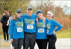  ??  ?? The Dorey family, from left, Abigail, Jeff, Emma and Anna, participat­ed in Sunday’s Turkey Trot and they also plan on running a virtual race Thursday morning.