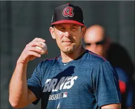  ?? CURTIS COMPTON / CCOMPTON@AJC.COM ?? Braves pitcher Darren O’Day works in the bullpen at spring training recently. O’Day has 11 years in the majors, an All-Star appearance and a career 2.56 ERA as a reliever. And he’s done it after a desperate change in delivery.