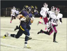  ?? MARK HUMPHREY ENTERPRISE-LEADER ?? Prairie Grove senior Jared Harger got outside and turned the corner for a 42-yard touchdown while running the football against Gentry Friday. The Pioneers escaped with a 28-21 win.