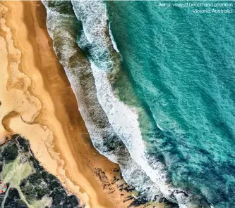  ??  ?? Aerial view of beach and ocean in
Victoria, Australia.