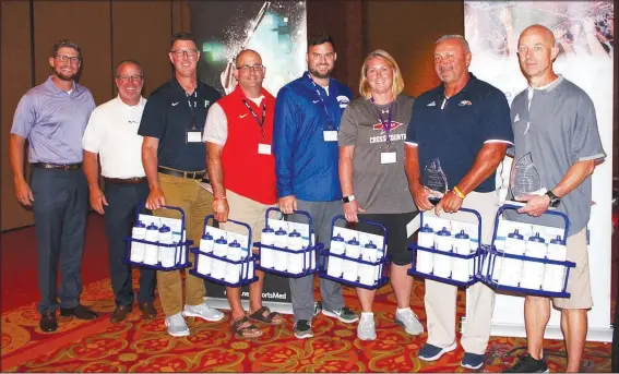  ?? NWA Democrat-Gazette/CARIN SCHOPPMEYE­R ?? Mitchell Mawby (from left), and Matt Mawby, Fincher supporters, stand with the group’s Hydration Heroes, Matt Hedstrom, Ryan Roughley, Adam Remillard, LouAnn Hays, Darren Hotelling and Preston Early, at the Beat the Heat luncheon July 25 at the John Q. Hammons Center in Rogers.