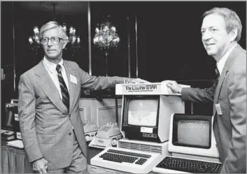  ?? Marty Lederhandl­er Associated Press ?? ALL WEATHER, ALL THE TIME Some dismissed the idea of a 24-hour weather network, but John Coleman, left, with publisher Frank Batten, launched the Weather Channel in 1981. Later in his career, Coleman became a climate change skeptic.