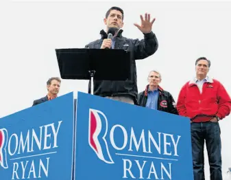  ?? Alex Wong / Getty Images ?? Rep. Paul Ryan, GOP vice presidenti­al candidate, addresses a rally in Vandalia, Ohio, with Mitt Romney (right), Kentucky Sen. Rand Paul (left), Ohio Sen. Rob Portman stumping with him.