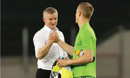  ??  ?? Ole Gunnar Solskjaer shakes hands with FC Copenhagen goalkeeper Karl-Johan Johnsson. Photograph: Wolfgang Rattay/AFP/Getty Images