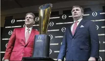  ?? ALYSSA POINTER / ALYSSA.POINTER@AJC.COM ?? Alabama head coach Nick Saban (left) and Georgia head coach Kirby Smart pose with the College Football National Championsh­ip trophy in Atlanta on Jan. 7.