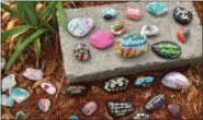  ?? WENDY GALLACHER VIA AP ?? This undated photo provided by Wendy Gallacher shows a selection of painted kindness rocks in Fayette County, Ga., which are part of the local Fayette Rocks Kindness Project.