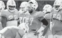  ?? CHRIS O'MEARA/AP ?? Center Daniel Kilgore (67) takes a break during a training camp practice between the Buccaneers and the Dolphins on Tuesday.