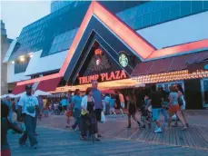  ?? WAYNEPARRY/AP ?? This July 2014 photo shows the former Trump Plaza casino in Atlantic City, NewJersey. The city will auction off the right to push the button to dynamite the former casino, which is now closed, to raise money for a local youth charity.